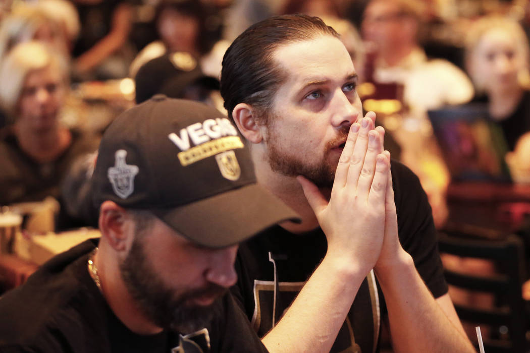 Jackson Loless, of Las Vegas, watches the Vegas Golden Knights play against the Winnipeg Jets d ...