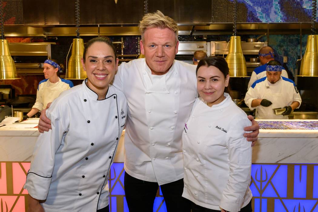 Star chef Gordon Ramsay is shown with Ariel Fox, left, and Michelle Tribble at Hell's Kitchen's one-year anniversary party at Caesars Palace on Friday, March 1, 2019. (Caesars Entertainment)