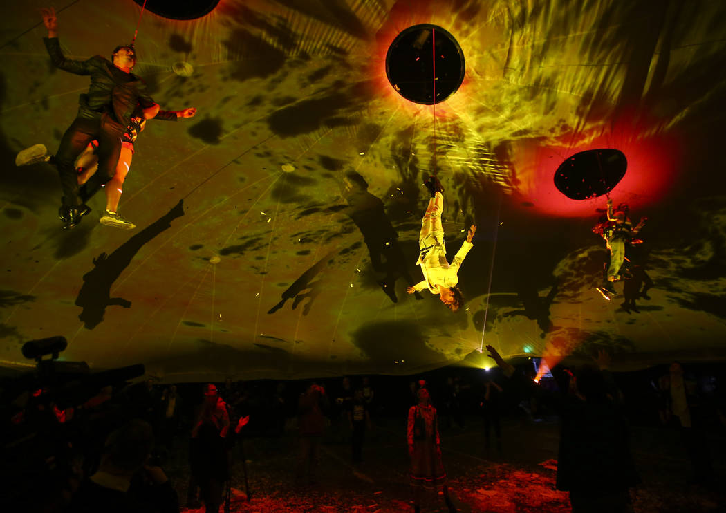 Cast members in "Fuerza Bruta" perform as part of a media preview at the show's tent ...