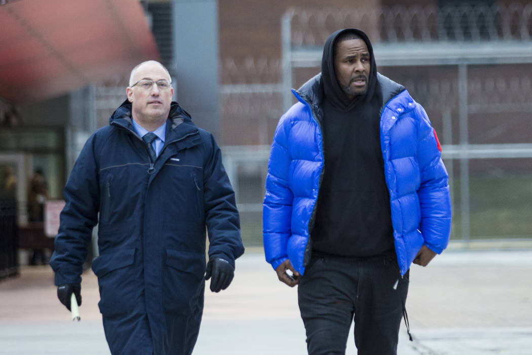 FR. Kelly, right, walks out of Cook County Jail with his defense attorney, Steve Greenberg after posting $100,000 bail in Chicago, Feb. 25, 2019. In his first interview since being charged with se ...