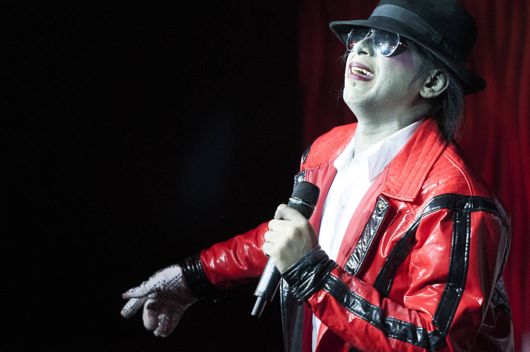 Sean E. Cooper entertains the crowd with his Michael Jackson impression during his show at Sin City Theatre inside Planet Hollywood hotel-casino in Las Vegas, Saturday, Dec. 7, 2013. (Erik Verduz ...