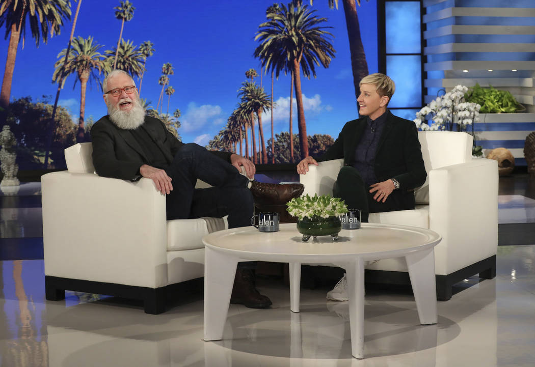 In this March 7, 2019 photo released by Warner Bros., David Letterman appears with host Ellen DeGeneres during a taping of "The Ellen DeGeneres Show" in Los Angeles. Letterman said he stuck around ...