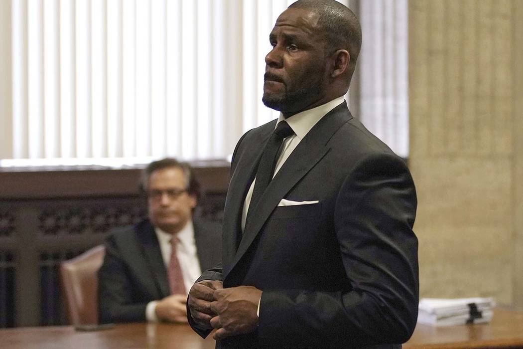 R. Kelly appears for a hearing at the Leighton Criminal Court Building on Friday, March 22, 2019 in Chicago. An overseas trip by R. Kelly is in limbo after his criminal attorney asked for more tim ...