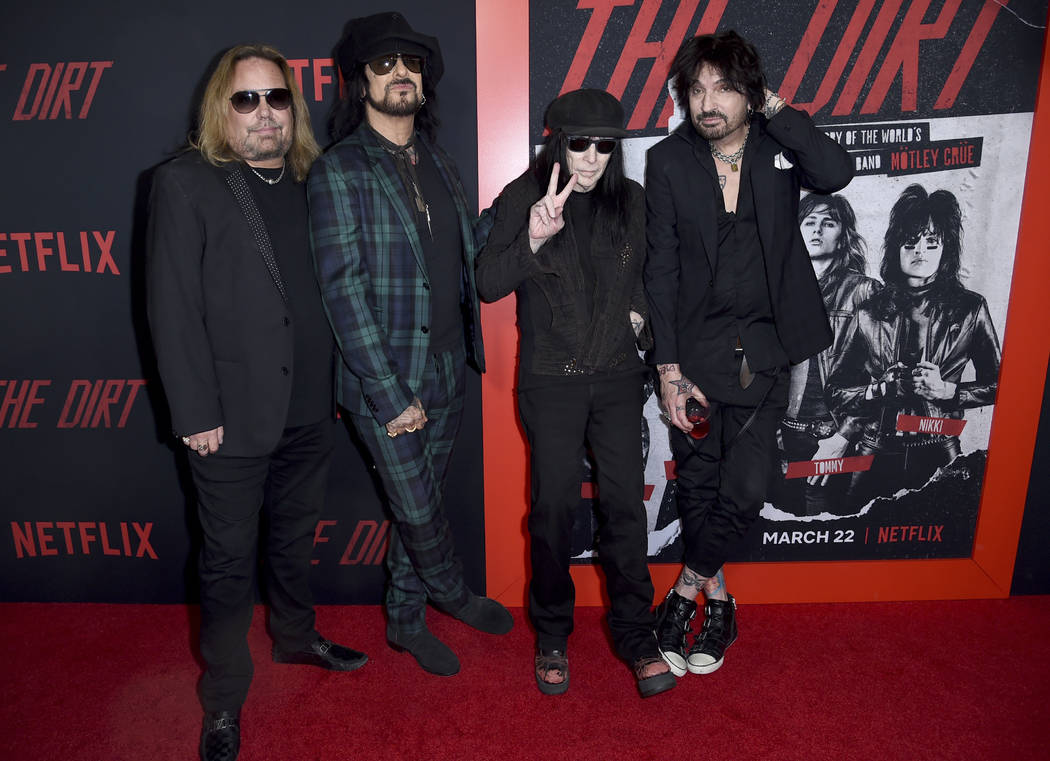 Vince Neil, from left, Nikki Sixx, Mick Mars and Tommy Lee, of Motley Crue, arrive at the world ...