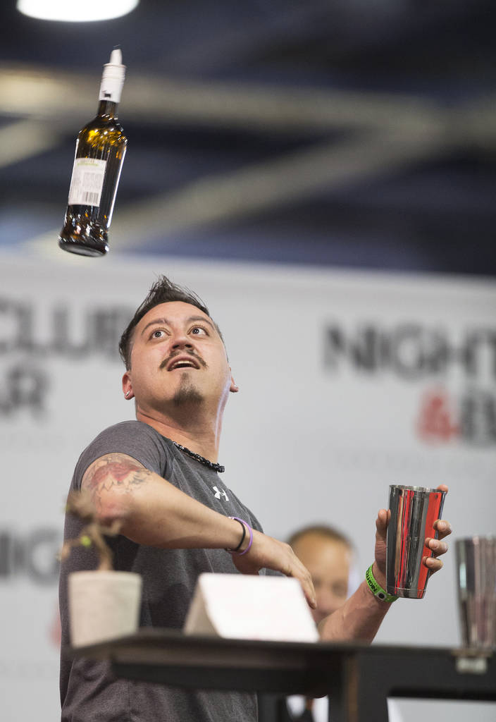 Michael Guzman performs in the flair bartending competition at the Nightclub and Bar Show on Tuesday, March 26, 2019, at the Las Vegas Convention Center, in Las Vegas. (Benjamin Hager Review-Journ ...
