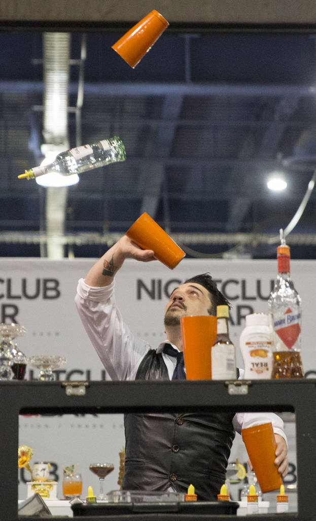 Luis Ortiz performs in the flair bartending competition at the Nightclub and Bar Show on Tuesday, March 26, 2019, at the Las Vegas Convention Center, in Las Vegas. (Benjamin Hager Review-Journal) ...