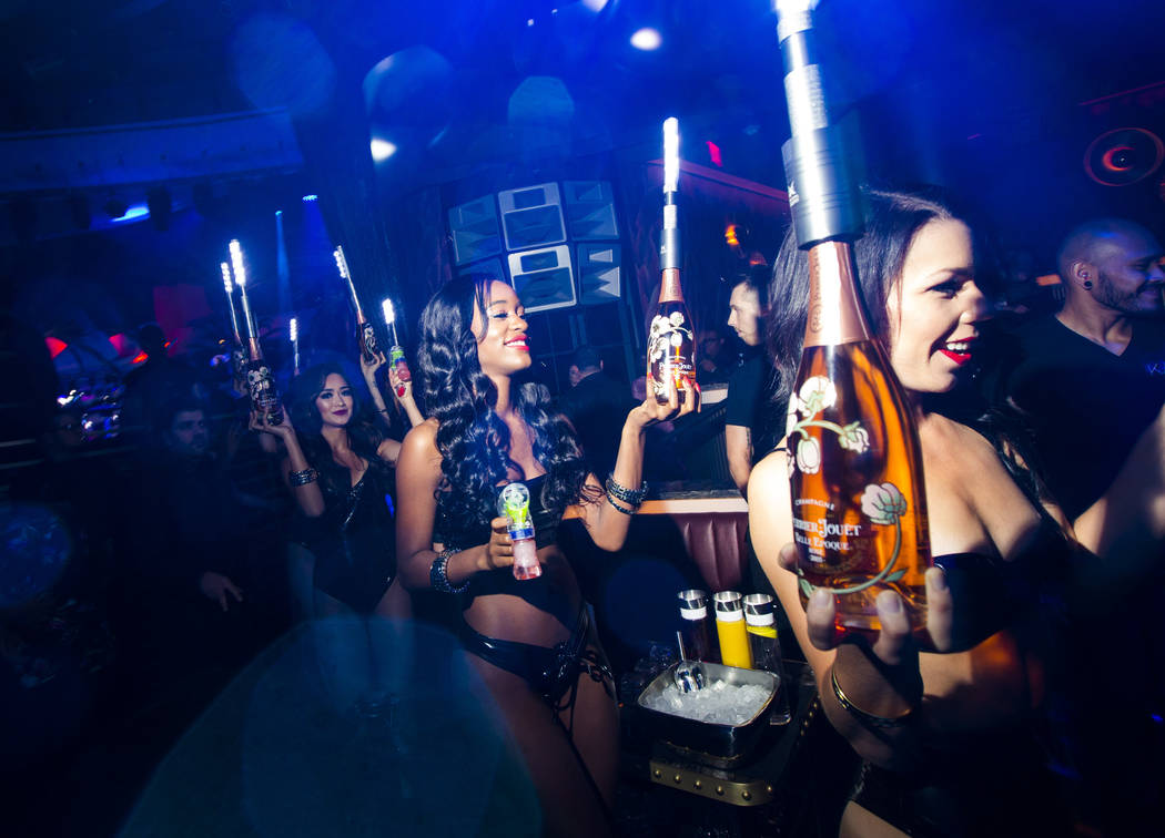 Bottles of champagne are delivered to a table in the nightclub area during the grand opening we ...
