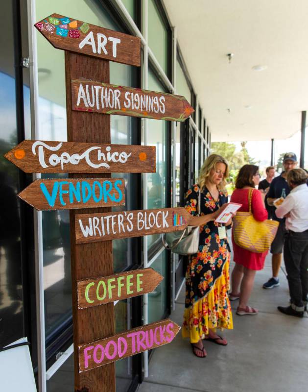 A crossroads sign directs participants during the Believer Festival, a three-day literary/art/c ...