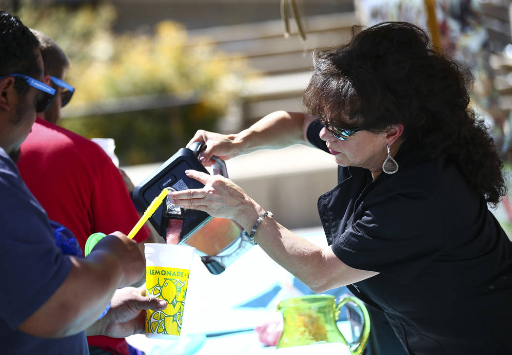 Leticia Mitchell, executive chef of Leticia's Mexican Cocina, pours sorbet for attendees after ...