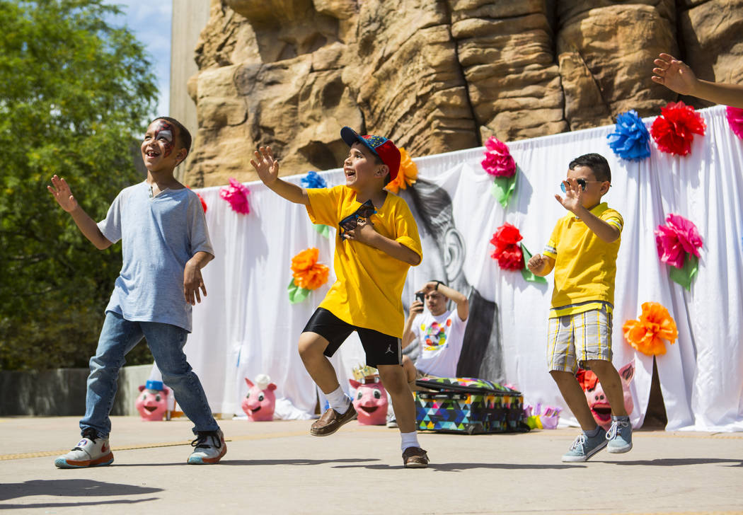 Seven-year-old Cristian Mendoza, center, of Las Vegas, and Christopher Villegas, 5, right, of L ...