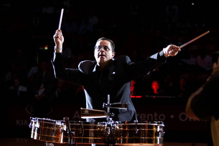 Tito Puente Jr. performs before an NBA basketball game between the Miami Heat and San Antonio S ...