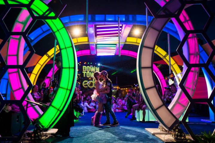Jessye Tolmich, left, and Dakota Tolmich, both of Denver, kiss during their wedding ceremony on ...