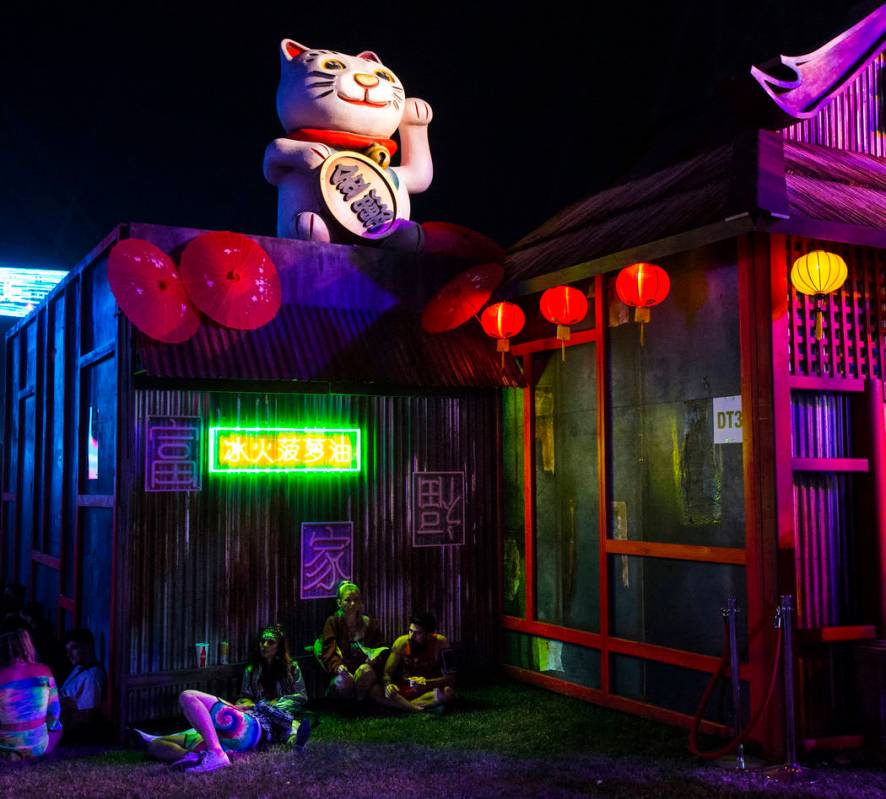 Attendees relax by the Tokyo Karaoke Bar during the second day of the Electric Daisy Carnival a ...