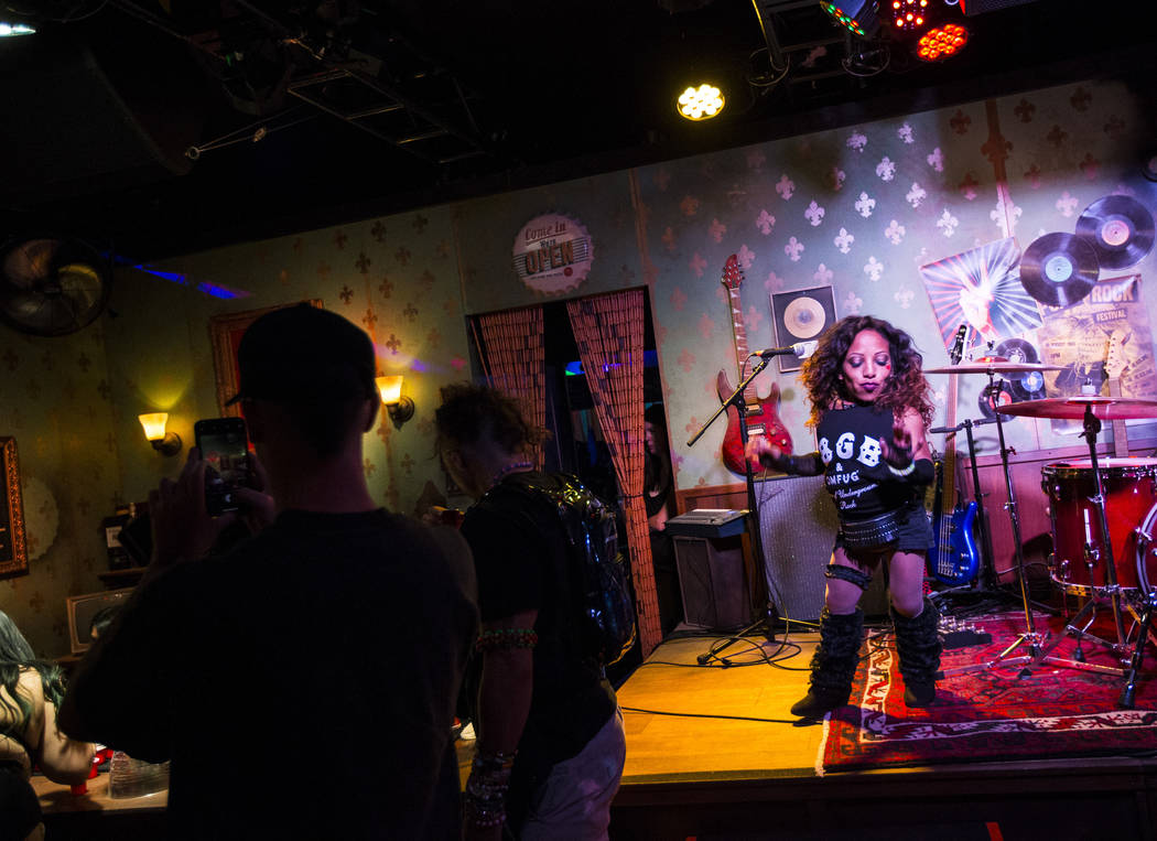 A performer dances at the punk-themed Mini Bar in Downtown EDC during the second day of the Ele ...