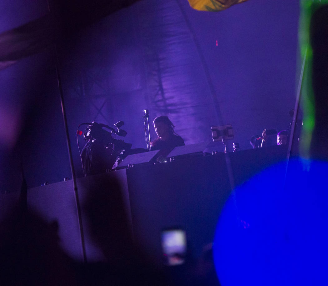 Skrillex performs during a surprise set at the Circuit Grounds stage during the second day of t ...