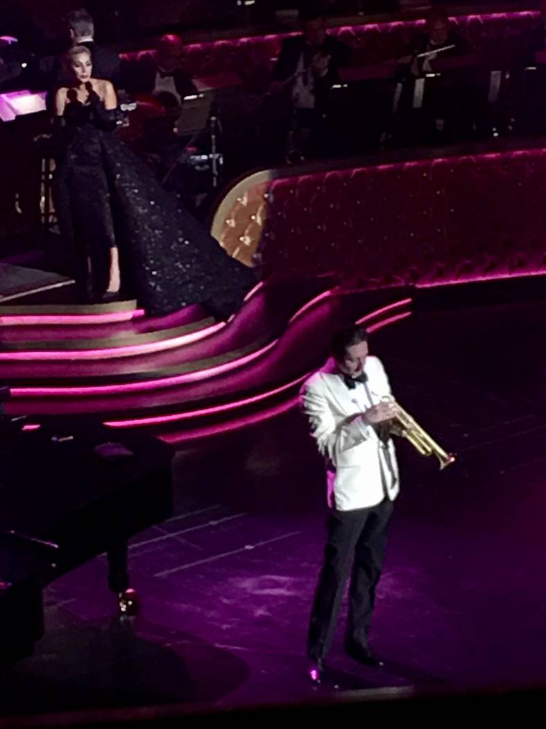 Lady Gaga sings behind the trumpet artistry of Brian Newman during her appearance at Encore Th ...