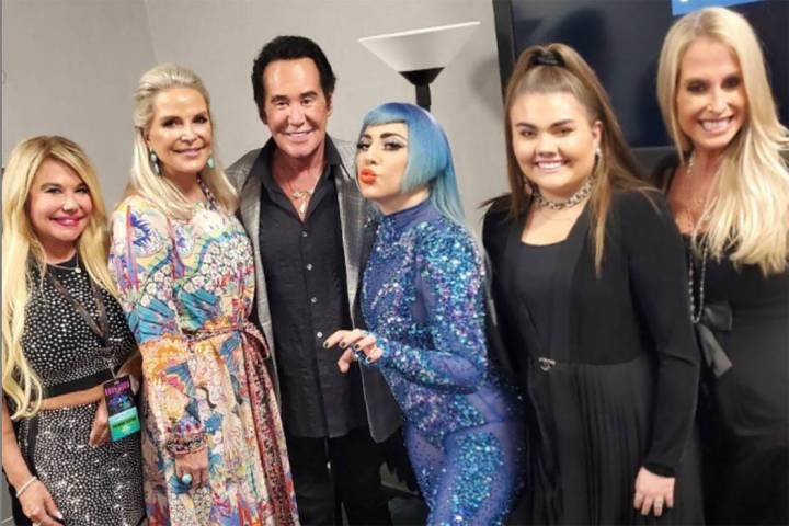 Lady Gaga greets Wayne Newton and his friends and family backstage at her 'Enigma' show at Park ...