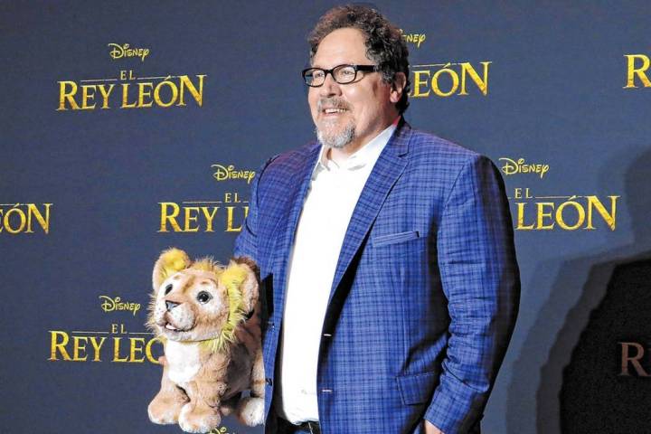 Director Jon Favreau poses during a news conference to promote his film, "The Lion King" on Jun ...