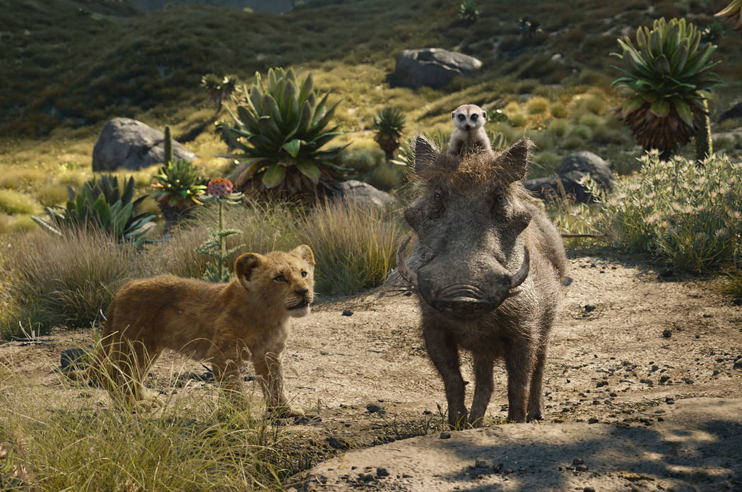 This image released by Disney shows, from left, young Simba, voiced by JD McCrary, Timon, voice ...