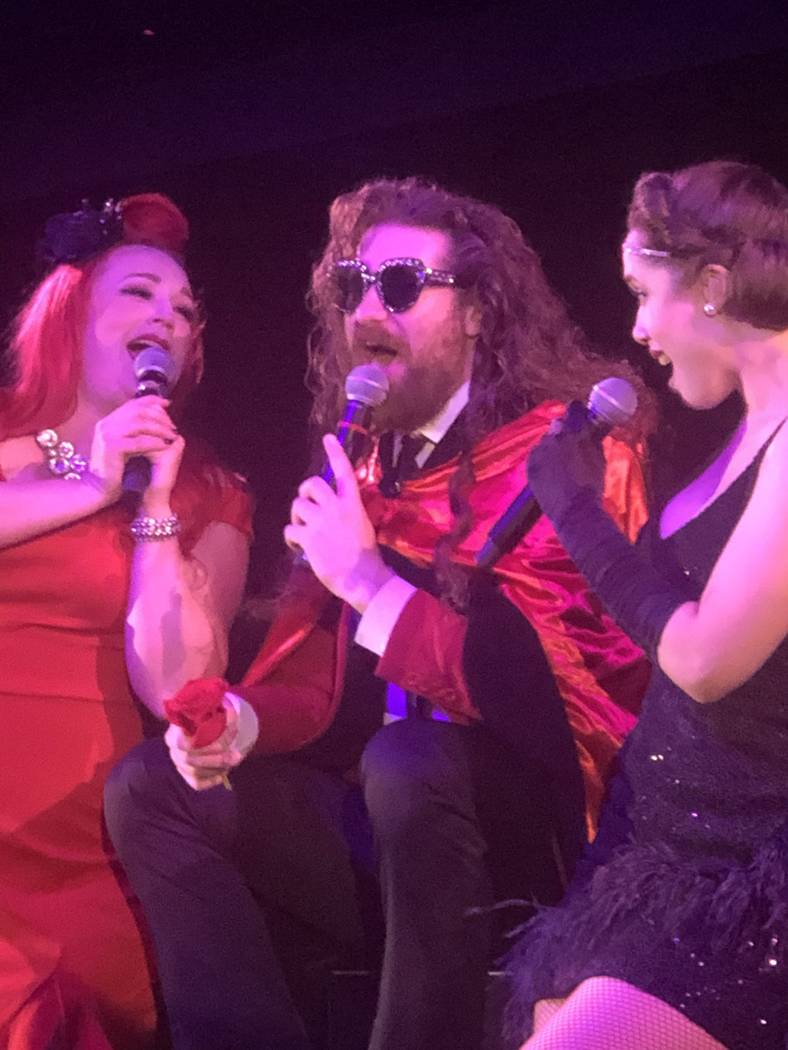 Casey Abrams, flanked by Dani Armstrong, left, and Jaclyn McSpadden, perform during the finale ...