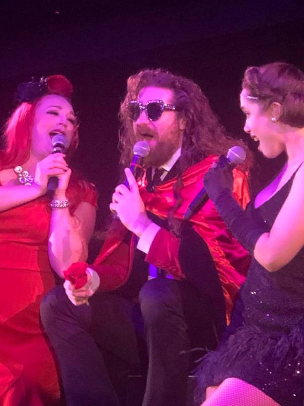 Casey Abrams, flanked by Dani Armstrong, left, and Jaclyn McSpadden, perform during the finale ...