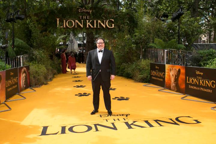 FILE - In this July 14, 2019 file photo, director Jon Favreau poses for photographers upon arri ...