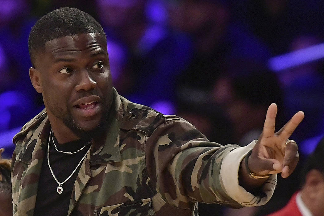 In this Jan. 29, 2019, file photo, actor Kevin Hart gestures during the second half of an NBA b ...