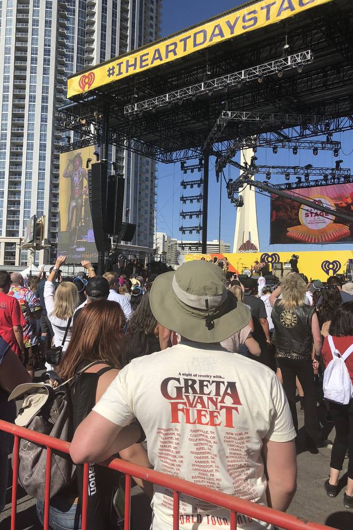 Fans listen near the stage as Greta Van Fleet plays at the iHeartRadio Music Festival's Daytime ...