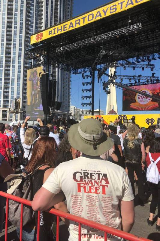 Fans listen near the stage as Greta Van Fleet plays at the iHeartRadio Music Festival's Daytime ...
