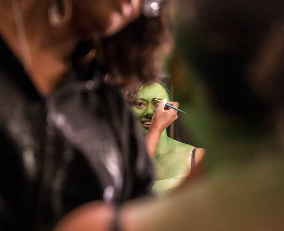 Mariand Torres, who plays Elphaba in "Wicked," gets her makeup done before the show at The Smit ...