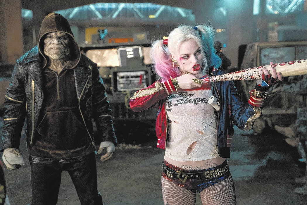Adewale Akinnuoye-Agbaje as Killer Croc and Margot Robbie as Harley Quinn in "Suicide Squad." ...