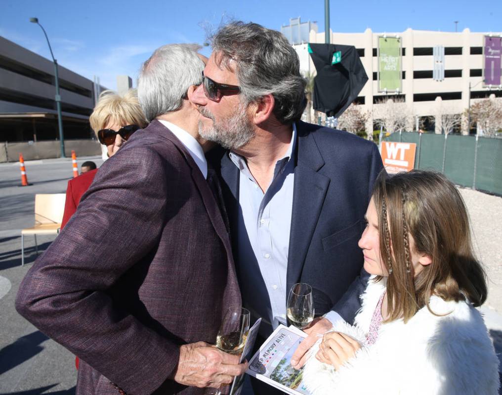 Larry Ruvo, left, visits with the late Robin Leach's son, Steve Leach and his daughter Gianna, ...