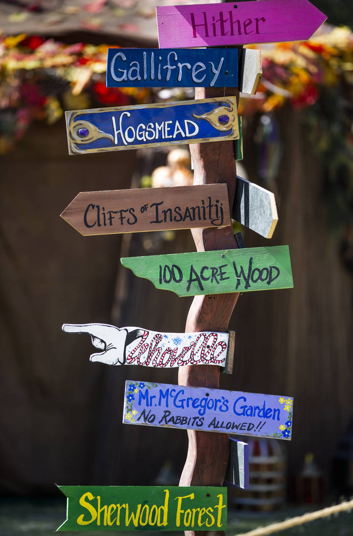 A signpost with location markers in the Greenwood Revelers encampment during the Age of Chivalr ...