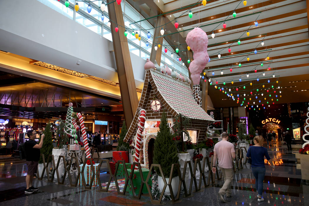 A 15-foot-tall gingerbread house in the lobby of Aria in Las Vegas Monday, Nov. 18, 2019. The t ...