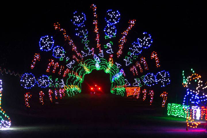 Vehicles drive through Glittering Lights on Sunday, Nov. 10, 2019, at Las Vegas Motor Speedway ...