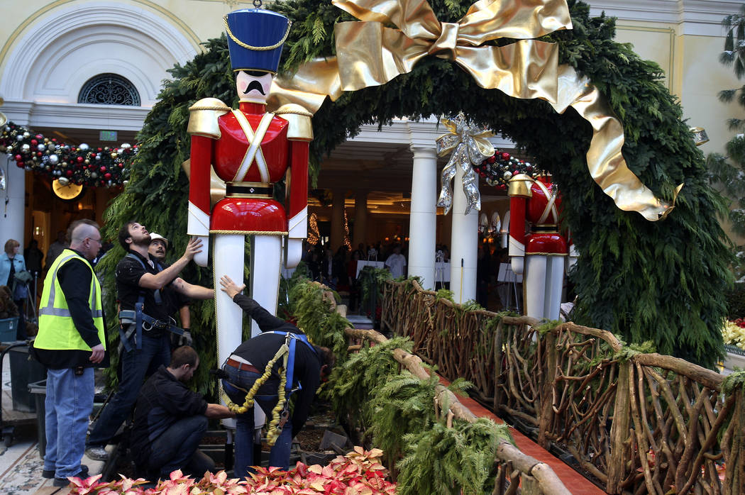 Workers arrange a wooden soldier figure Dec. 5, 2008, in preparation of the Bellagio Conservato ...