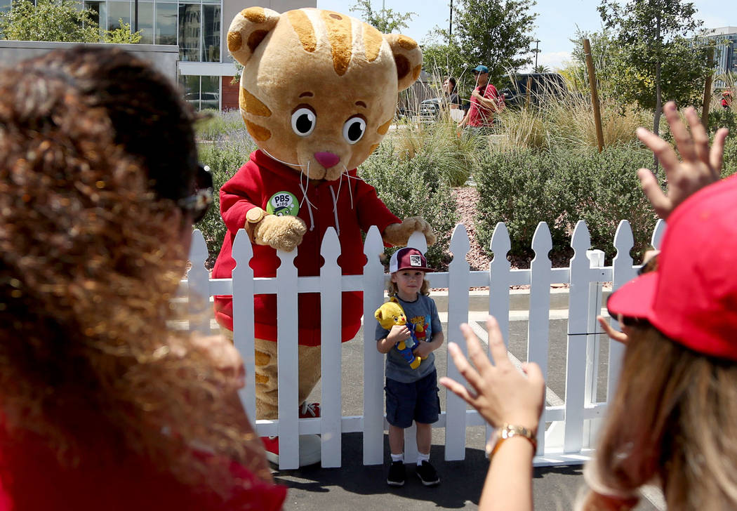 Braeden Klatt, 3, poses for a photo with PBS Kids television star Daniel Tiger during " Be My N ...