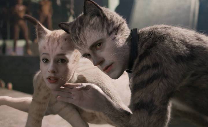 (from left) Victoria (Francesca Hayward) and Munkustrap (Robbie Fairchild) in "Cats," ...