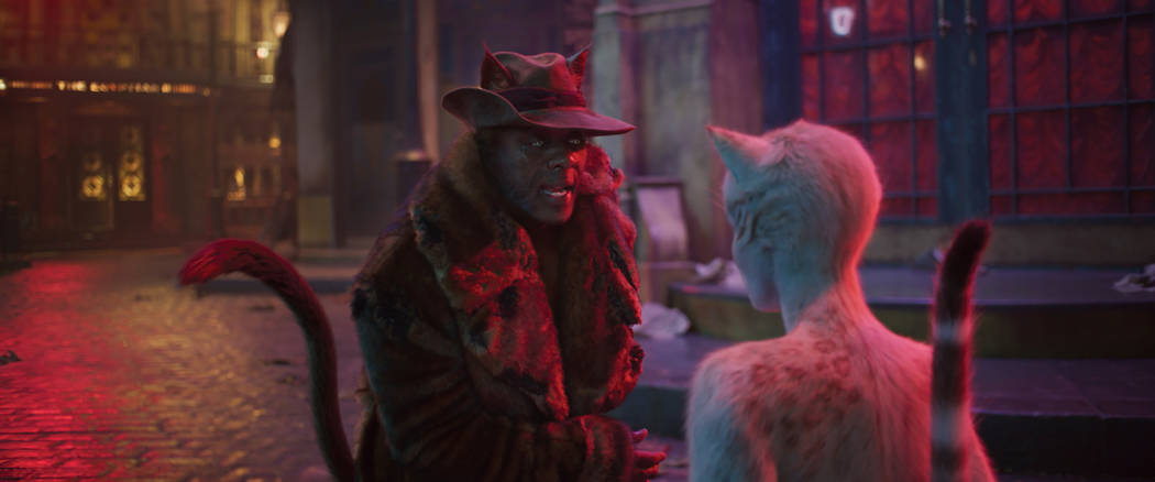 (from left) Macavity (Idris Elba) and Victoria (Francesca Hayward, back to camera) in "Cat ...