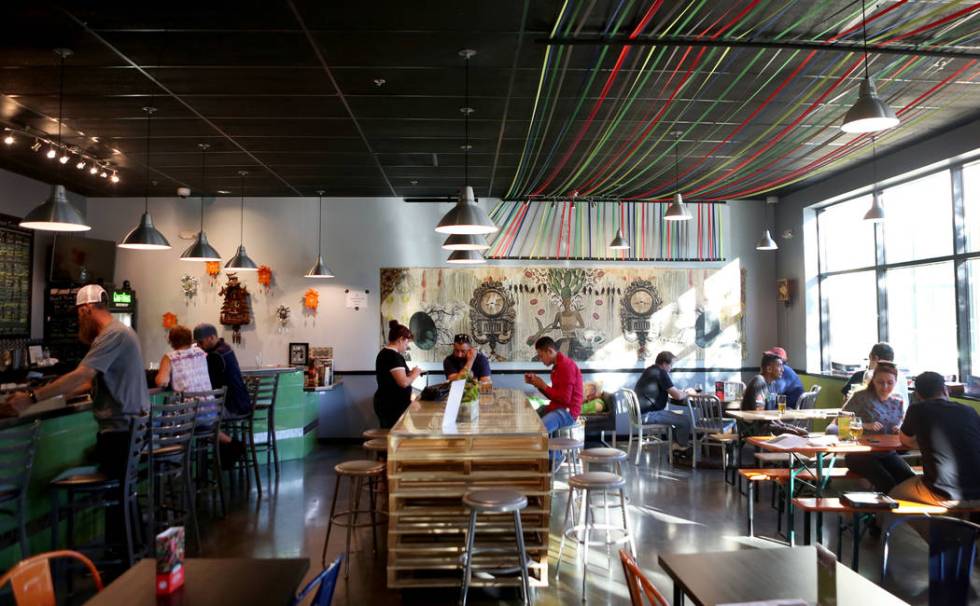 People play games, eat and drink beer at Crafthaus Brewery during the Silver State beer kicks o ...