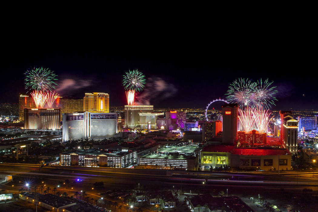 Fireworks for New Year's Eve erupt over the Strip as viewed from the VooDoo Rooftop Nightclub & ...