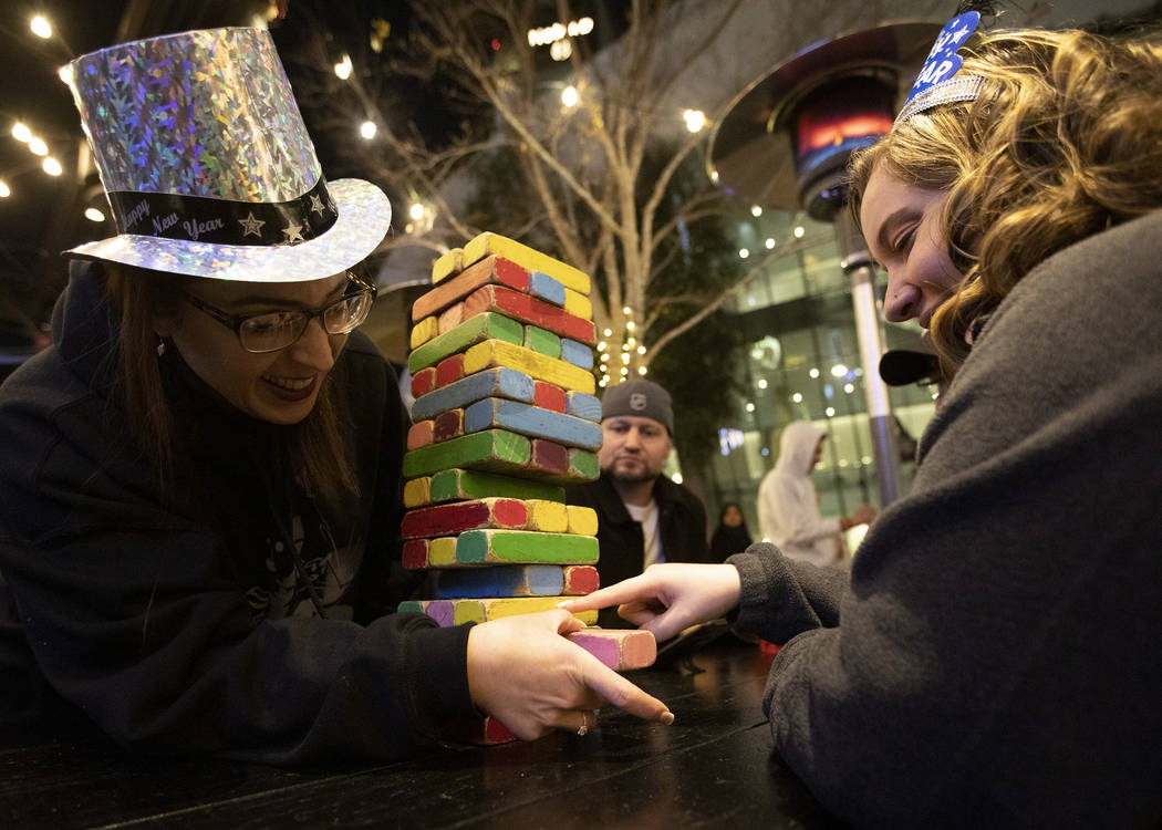Jennifer Simpson, left, of Las Vegas, and her sister-in-law Megan Simpson, right, of Illinois, ...