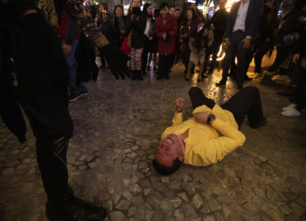 German Moreno of California lays on the pavement after failing at the worm in the center of a d ...