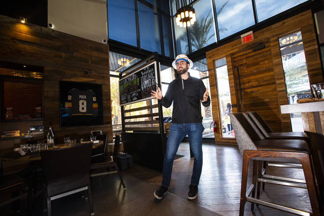 Golden Knights' Alex Tuch talks during a tour of the current Wolfgang Puck Bar & Grill spac ...
