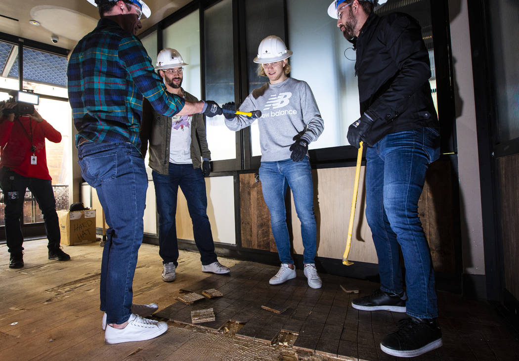 Golden Knights players, from left, Reilly Smith, Deryk Engelland, William Karlsson and Alex Tuc ...