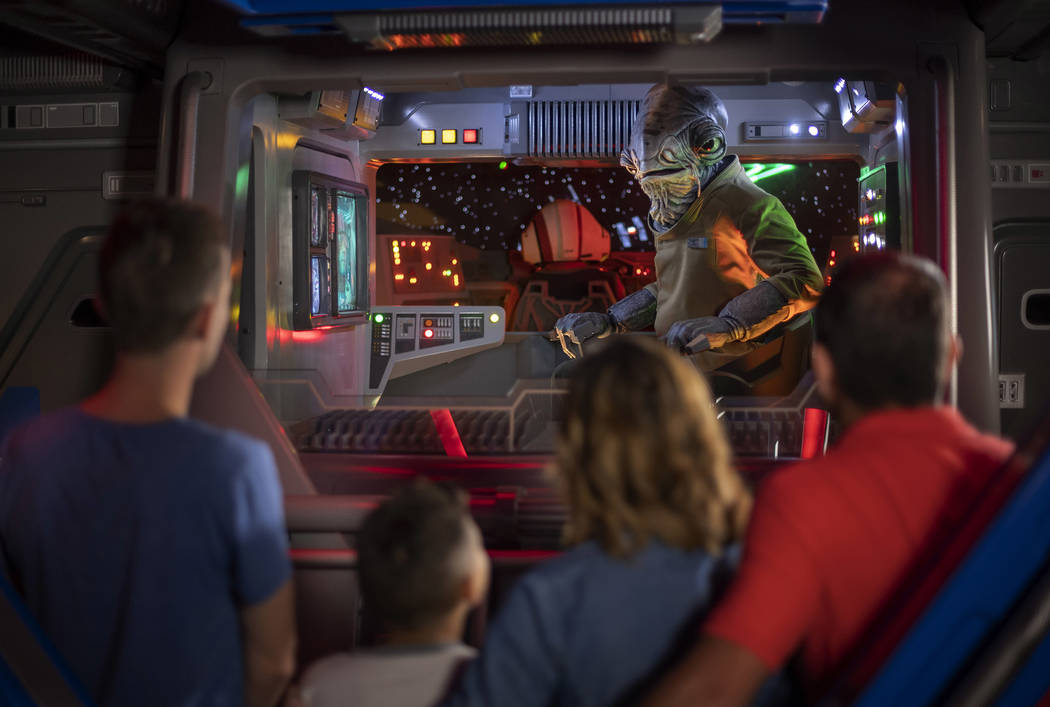 Lieutenant Bek, a Mon Calamari Resistance officer, speaks with guests aboard an Intersystem Tra ...