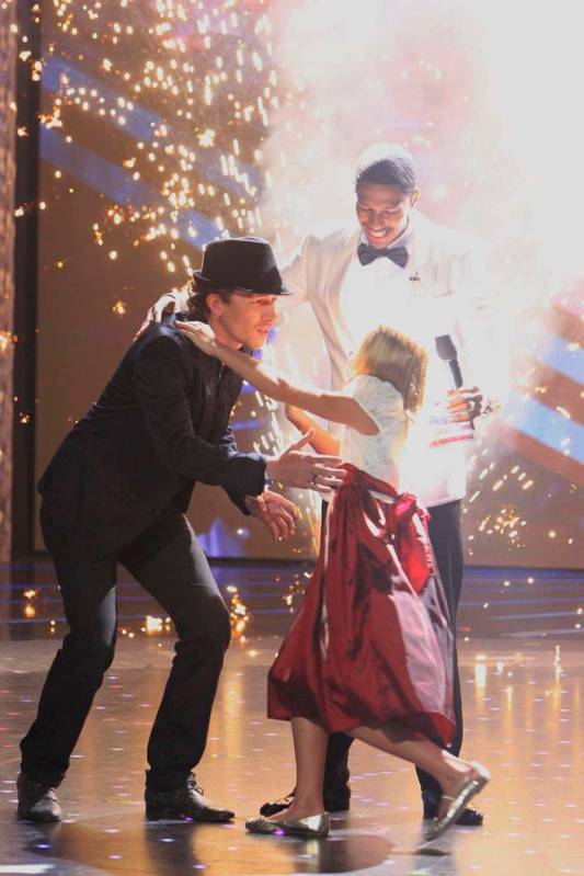 From left, Michael Grimm, Nick Cannon and Jackie Evancho perform in "America's Got Talent." (Tr ...
