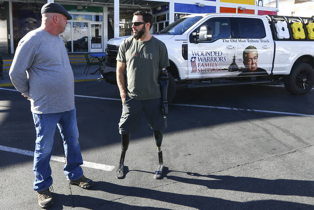 Rick Harrison, left, talks with Navy veteran and Purple Heart recipient Andrew Bottrell, who wa ...