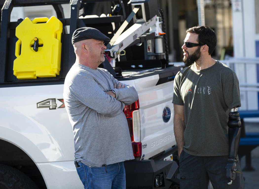 Rick Harrison, left, talks with Navy veteran and Purple Heart recipient Andrew Bottrell, who wa ...