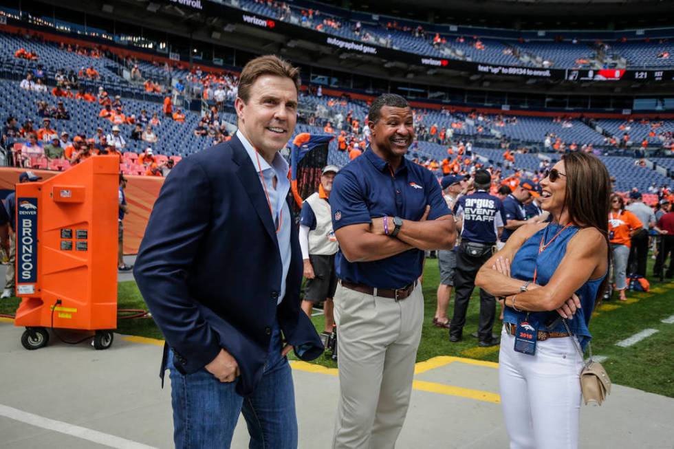 Former Denver Broncos Bill Romanowski, left, Steve Atwater and Julie Romanowski talk prior to a ...